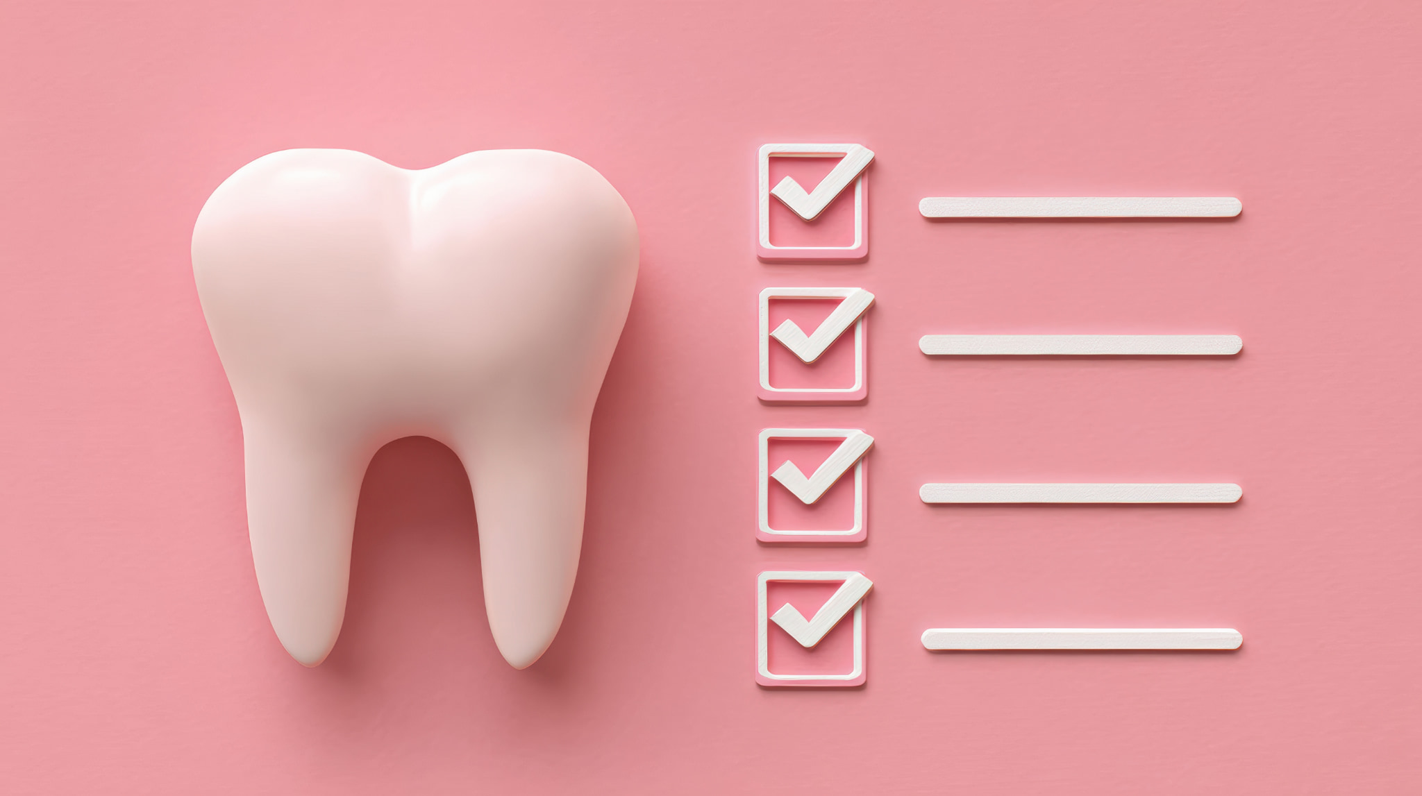 インプラント治療を受ける条件を示す歯の模型とチェックリスト